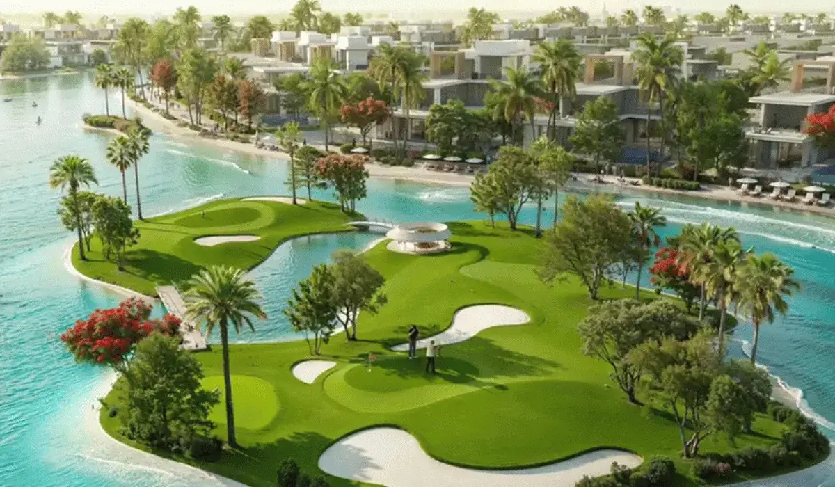 Lush golf island resort showcasing the pros of living in Damac Islands with scenic water views.